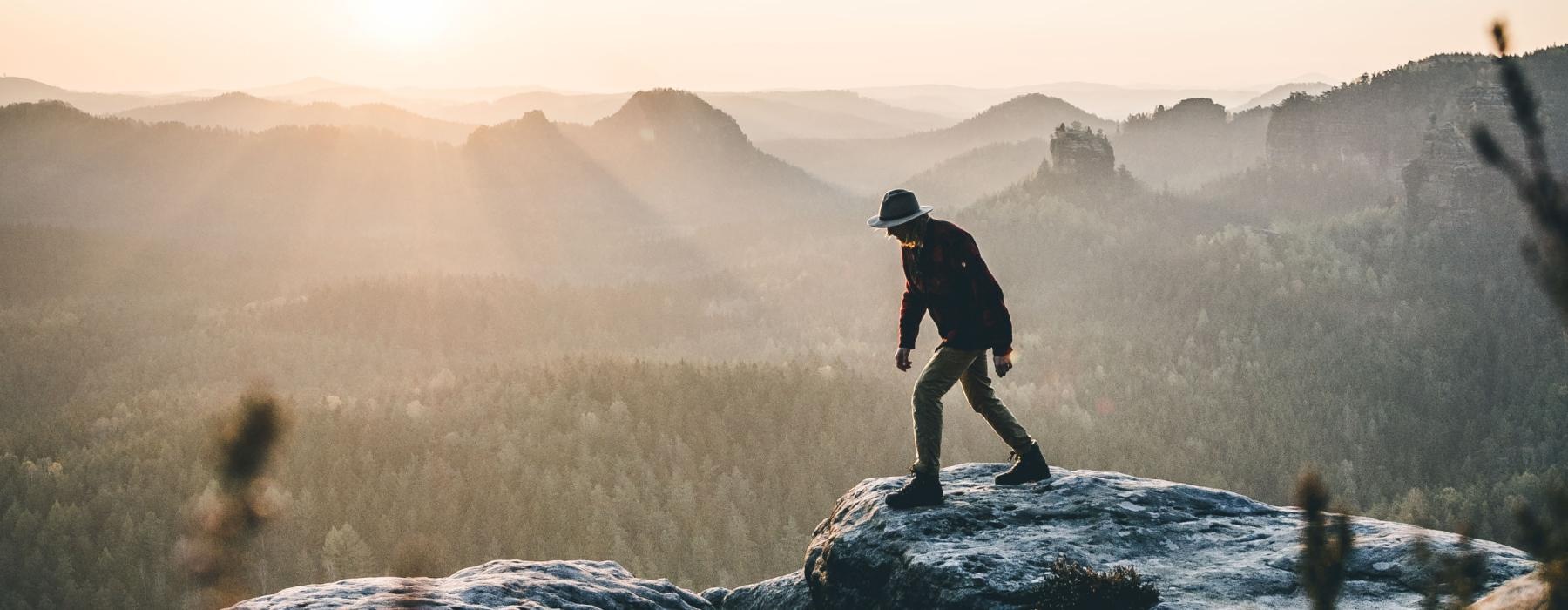 man hiking on a mountain