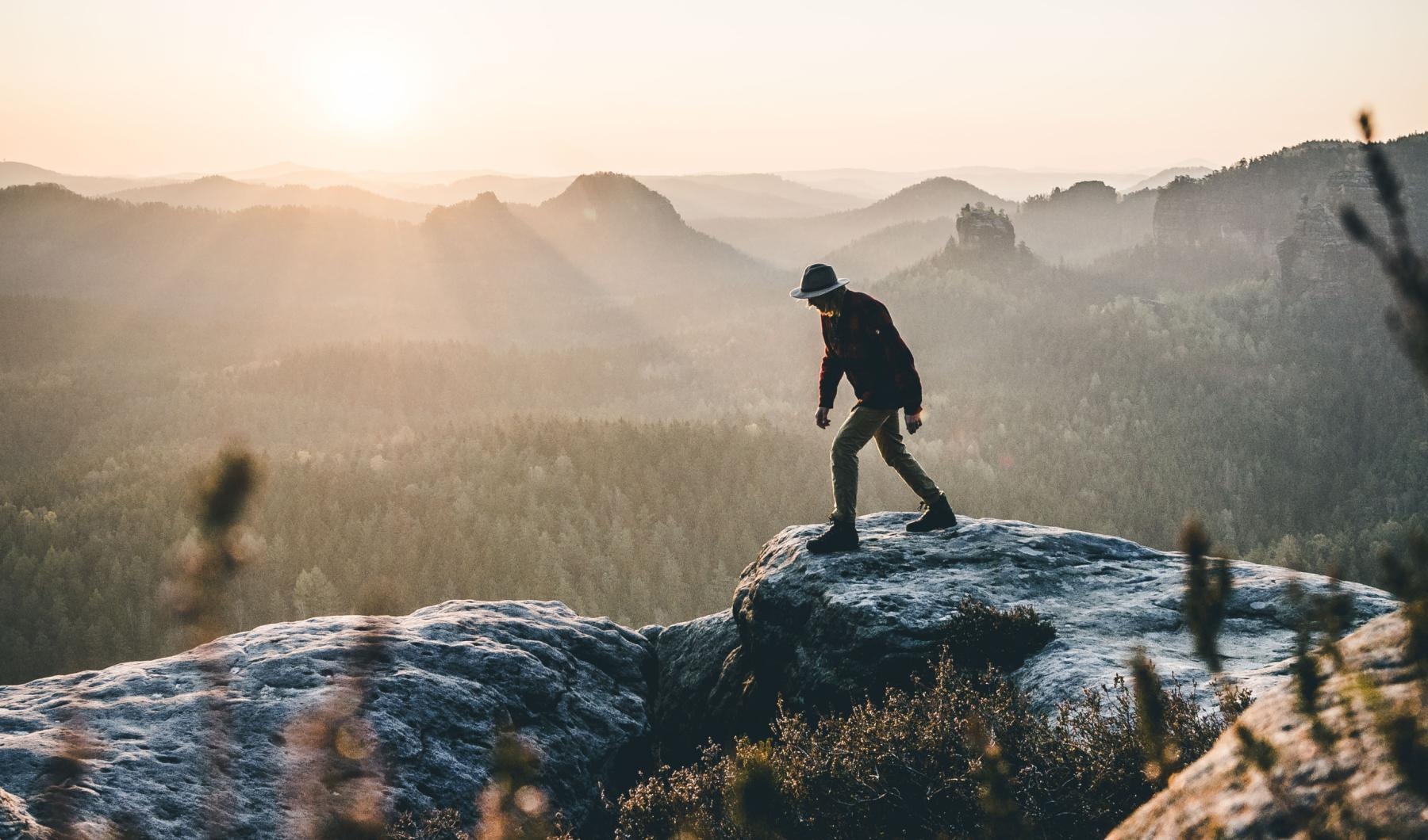 A beautiful community at the heart of all your passions man hiking on a mountain